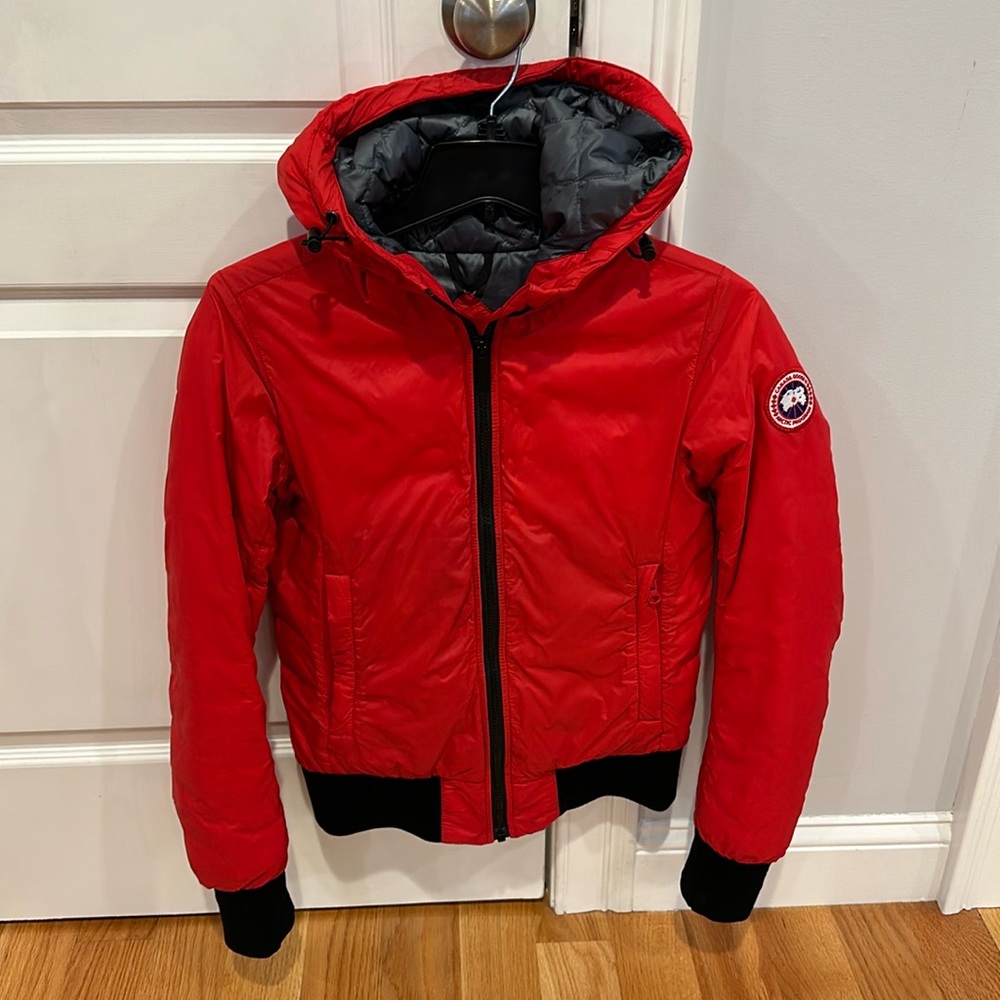 Like NEW condition red Canada Goose hooded bomber size small. Minimal wear!